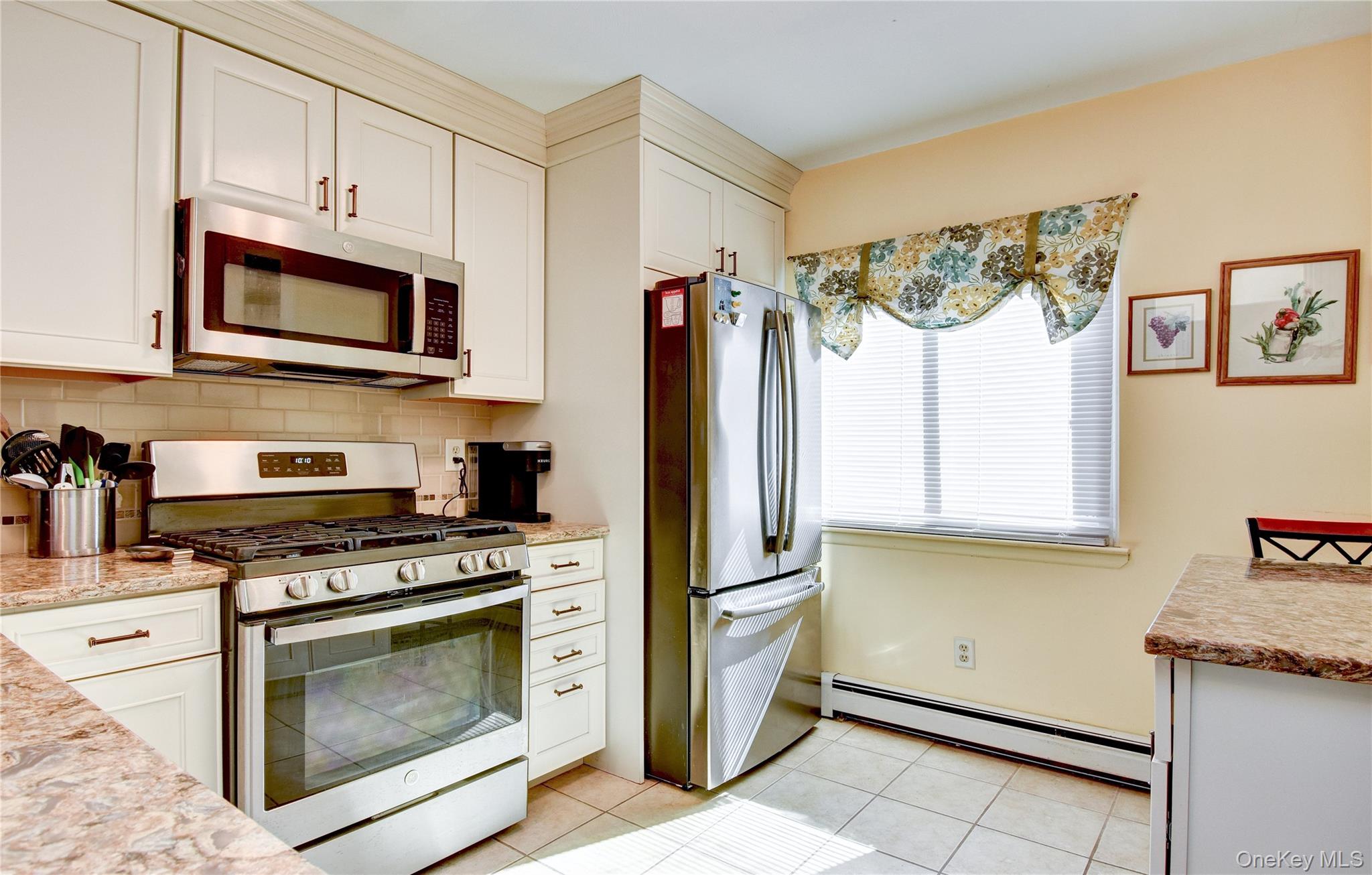 39 Butler Drive Goshen, NY 10924 - Photo 8 of 29 a kitchen with stainless steel appliances granite countertop a refrigerator stove and microwave