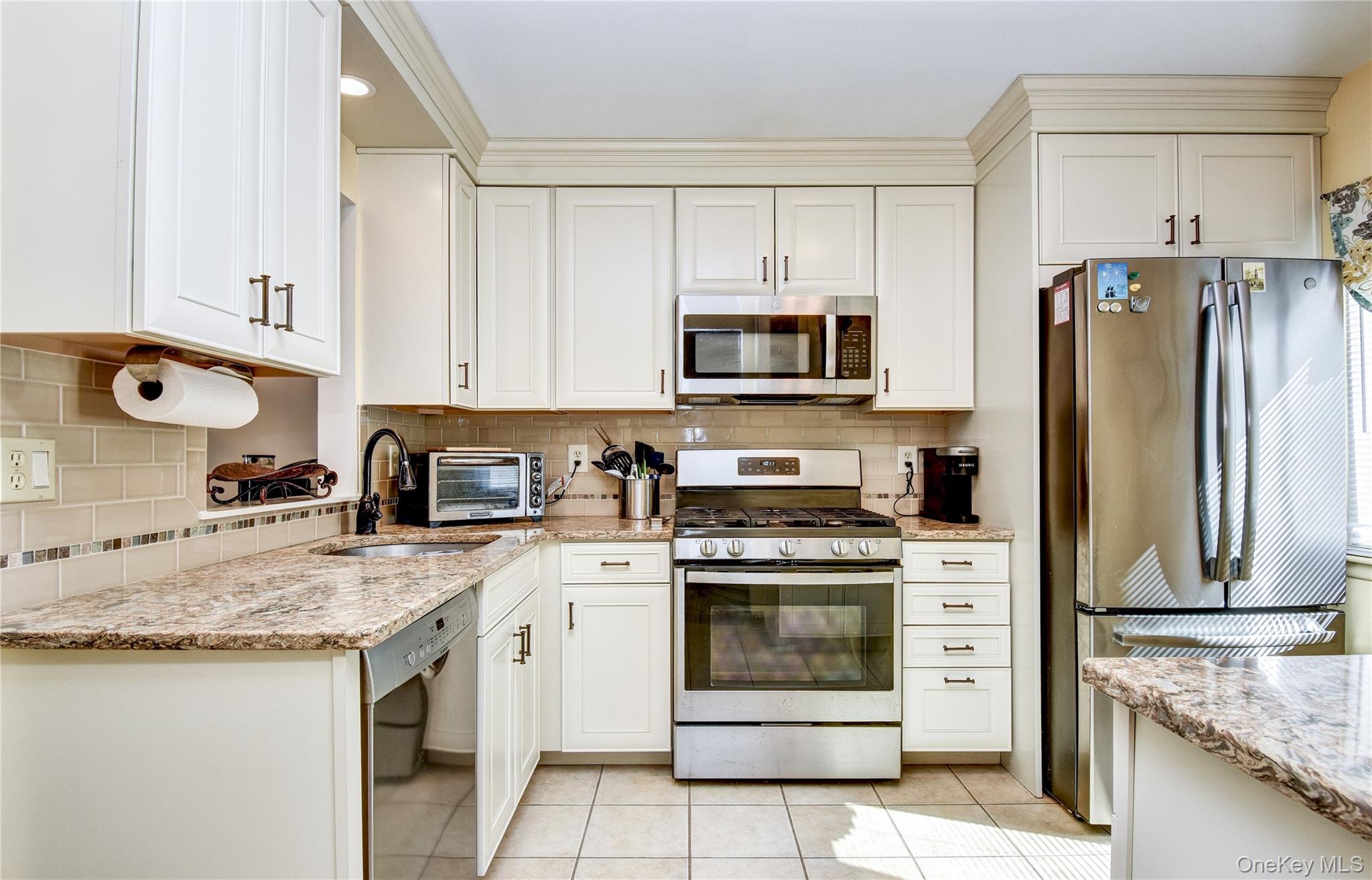 39 Butler Drive Goshen, NY 10924 - Photo 9 of 29 a kitchen with granite countertop a stove sink and refrigerator