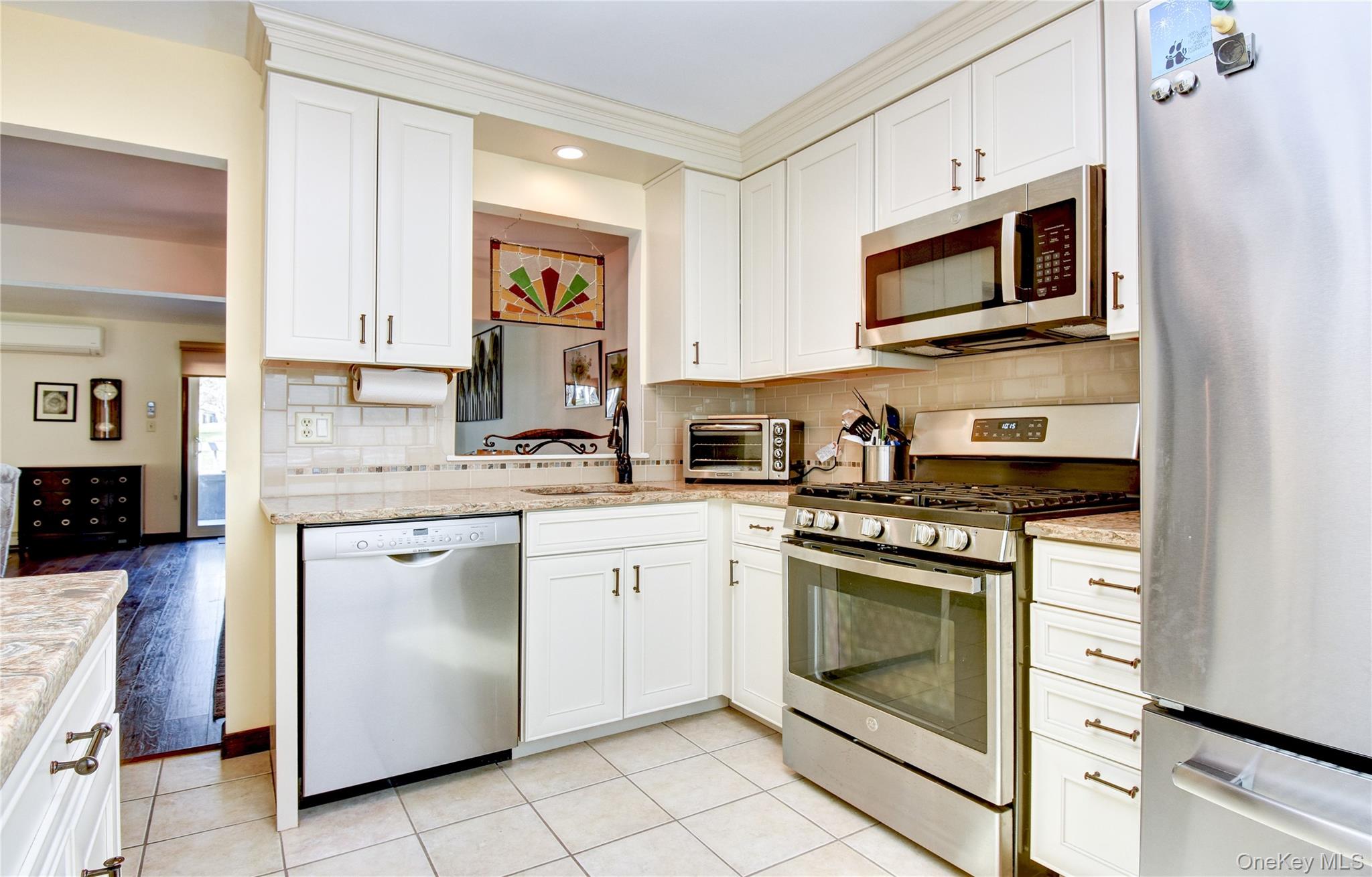 39 Butler Drive Goshen, NY 10924 - Photo 10 of 29 a kitchen with cabinets stainless steel appliances and a sink