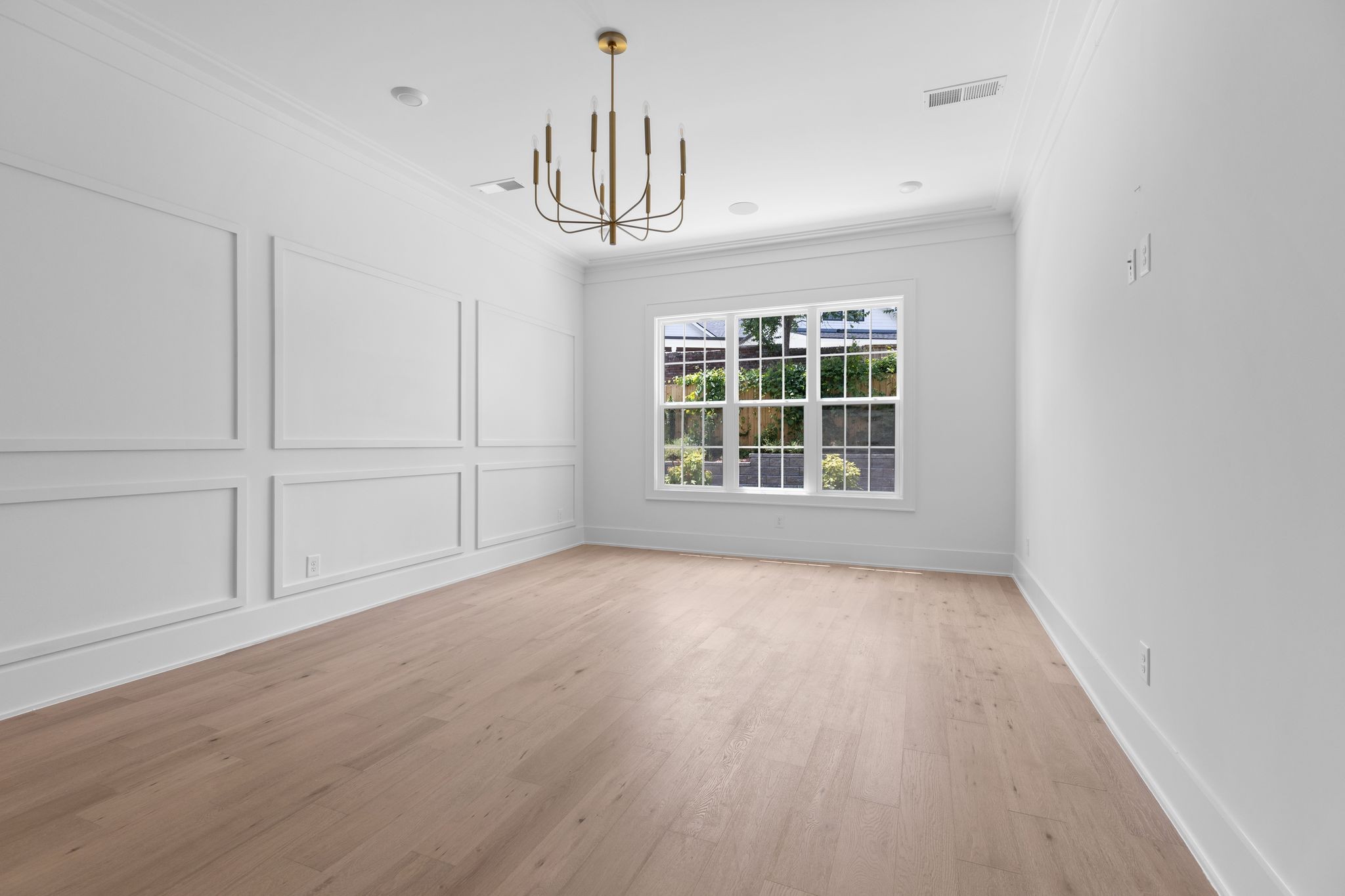 2823 Sugar Tree Road Nashville, TN 37215 - Photo 15 of 59 an empty room with wooden floor chandelier and windows