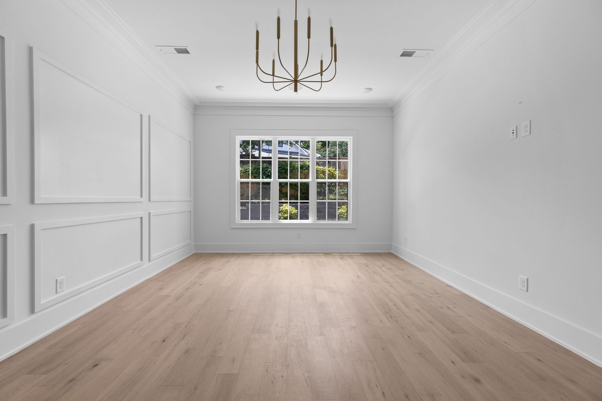 2823 Sugar Tree Road Nashville, TN 37215 - Photo 16 of 59 a view of an empty room with wooden floor and a window