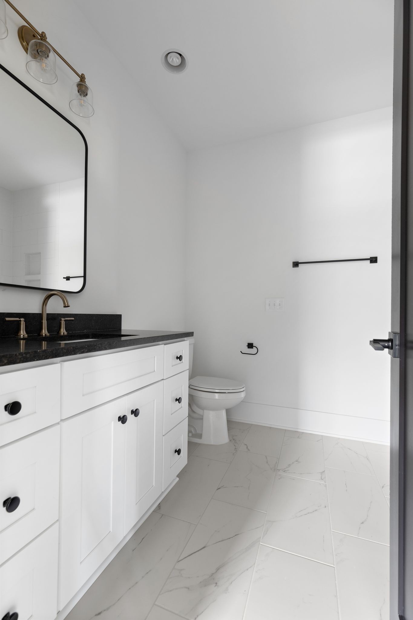 2823 Sugar Tree Road Nashville, TN 37215 - Photo 35 of 59 a bathroom with a granite countertop sink a toilet and a mirror