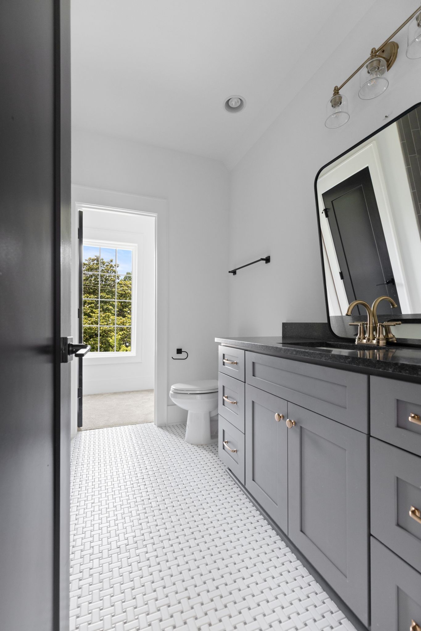 2823 Sugar Tree Road Nashville, TN 37215 - Photo 40 of 59 a bathroom with a toilet a sink and mirror