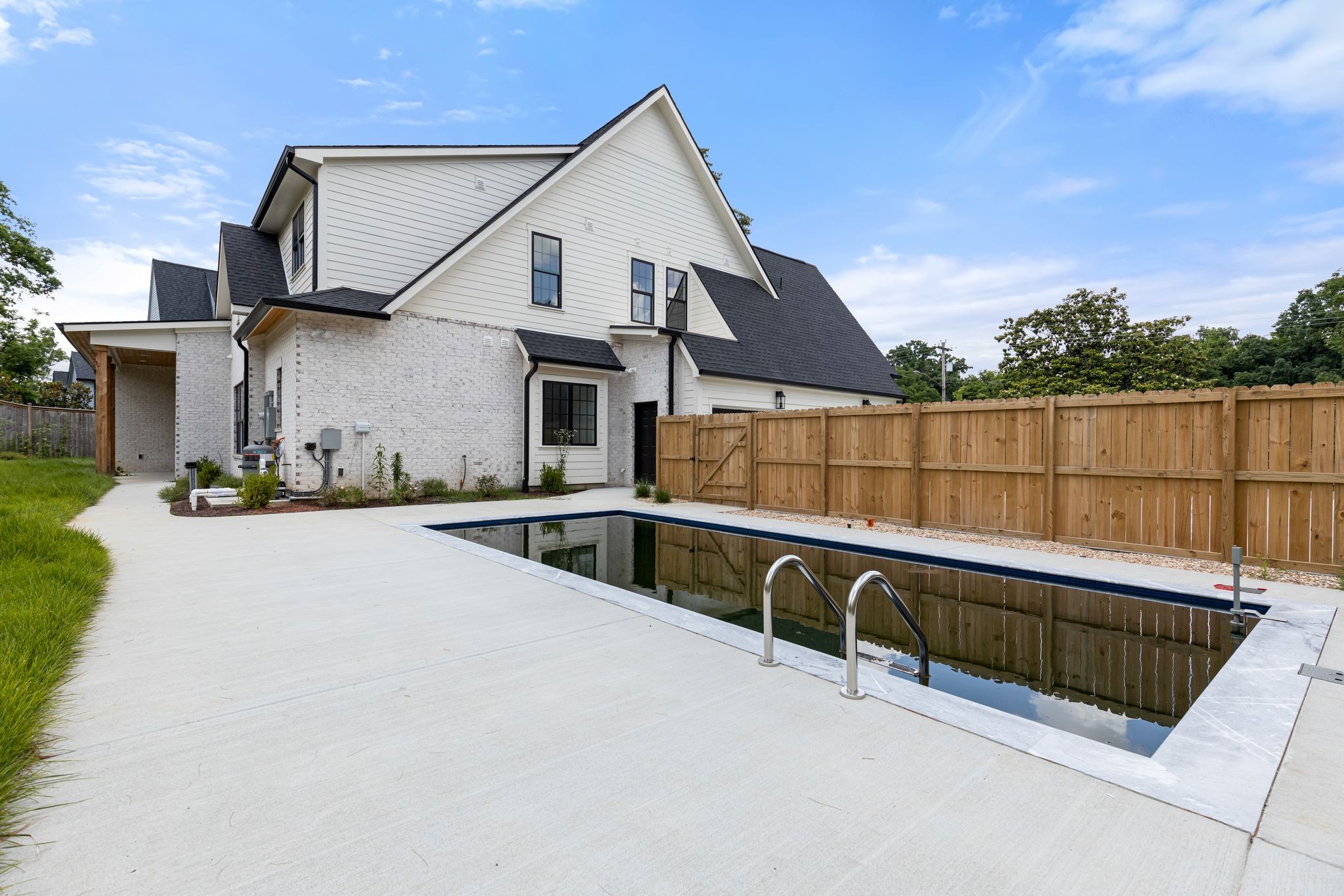 2823 Sugar Tree Road Nashville, TN 37215 - Photo 58 of 59 a view of a house with large pool and sitting area