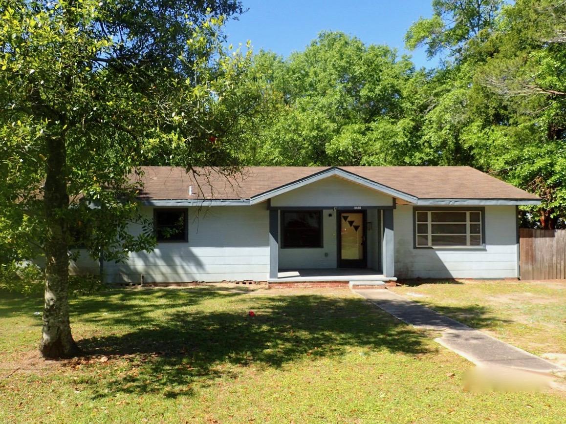 1088 Mapoles Street Crestview, FL 32536 - Photo 1 of 6 a front view of a house with a yard