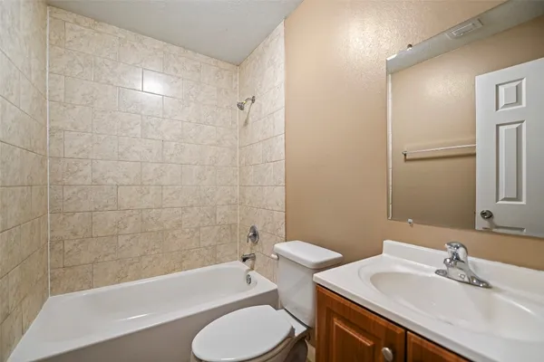 a bathroom with a sink toilet and bathtub