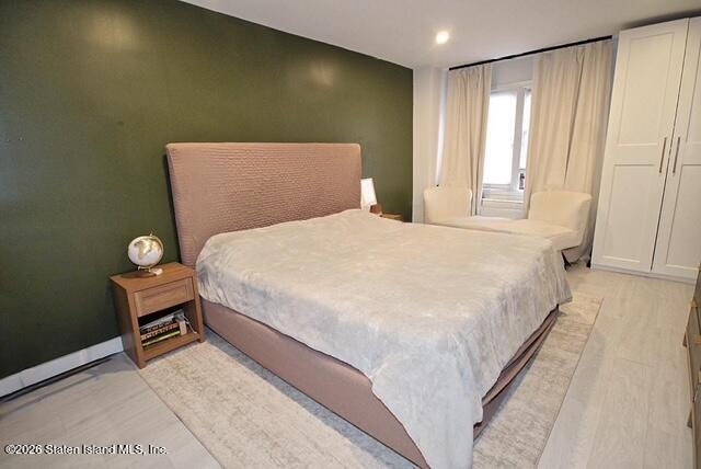 1000 Clove Road, Unit 2P Staten Island, NY 10301 - Photo 12 of 22 a bedroom with a bed and a window
