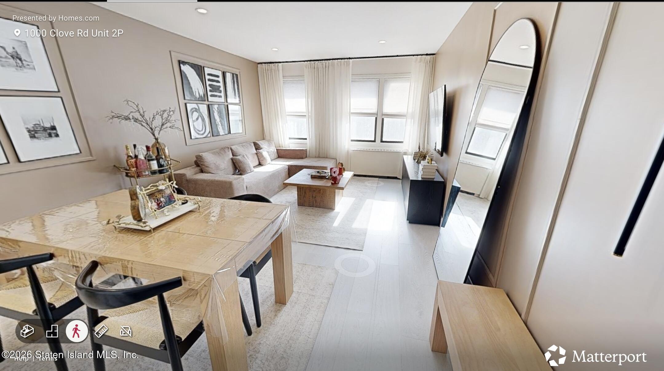 1000 Clove Road, Unit 2P Staten Island, NY 10301 - Photo 2 of 22 a living room with furniture and a large window