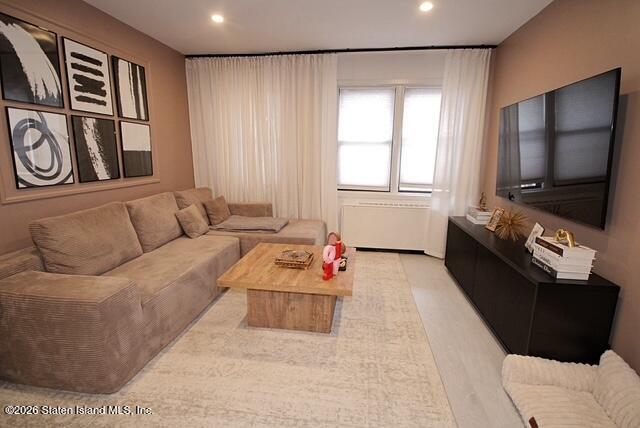 1000 Clove Road, Unit 2P Staten Island, NY 10301 - Photo 5 of 22 a living room with furniture and a flat screen tv