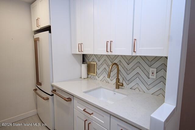 1000 Clove Road, Unit 2P Staten Island, NY 10301 - Photo 9 of 22 a kitchen with a sink and a refrigerator