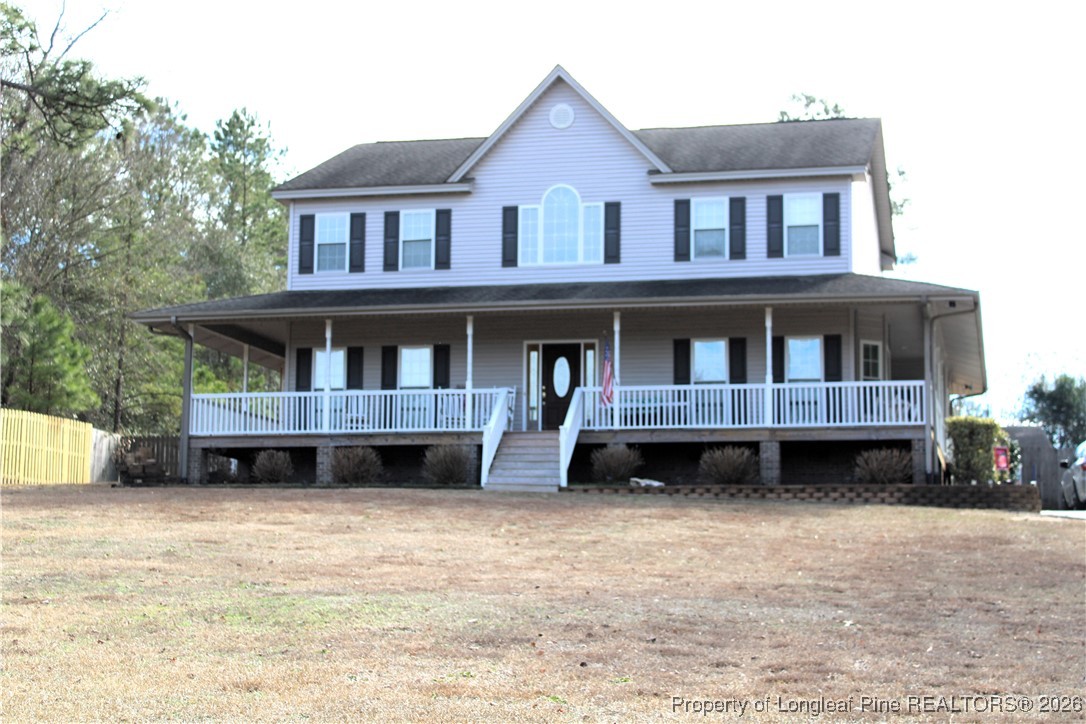573 Porter Road Hope Mills, NC 28348 - Photo 1 of 29 a front view of residential houses with yard
