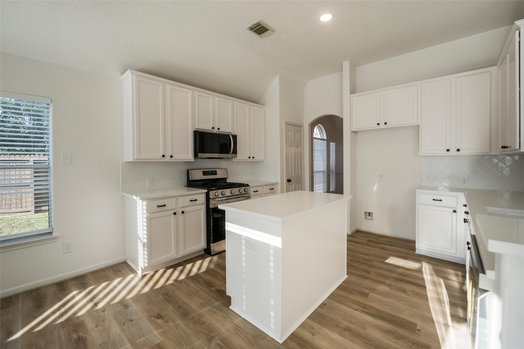 3303 Viking Landing Court Spring, TX 77388 - Photo 14 of 46 a kitchen with a stove a sink and a refrigerator