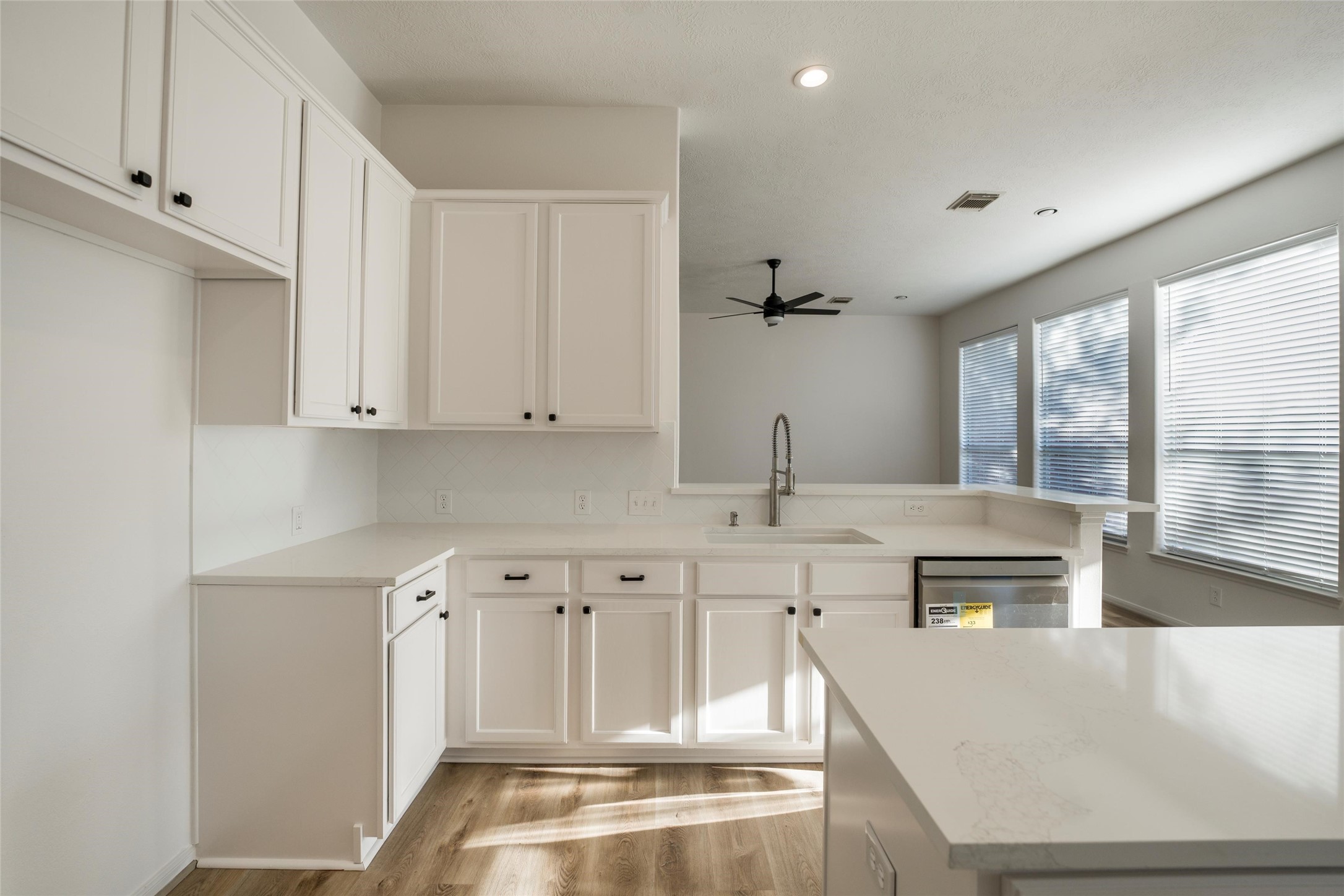 3303 Viking Landing Court Spring, TX 77388 - Photo 16 of 46 a kitchen with stainless steel appliances granite countertop a sink and white cabinets