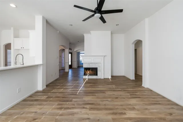 a view of empty room with a fireplace