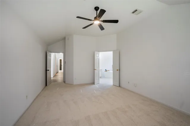 en empty room with closet and windows