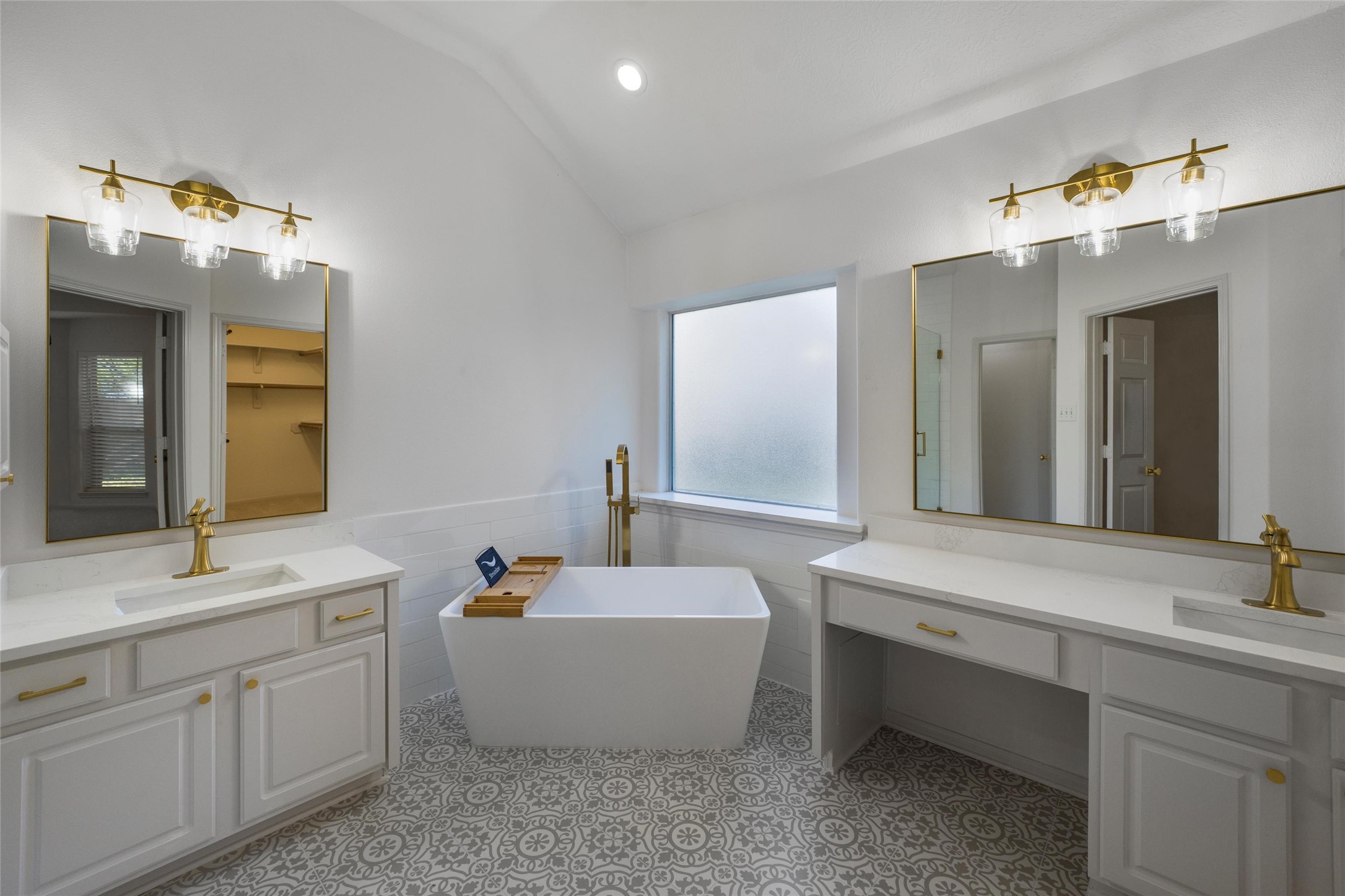 3303 Viking Landing Court Spring, TX 77388 - Photo 25 of 46 a bathroom with a double vanity sink mirror and bathtub