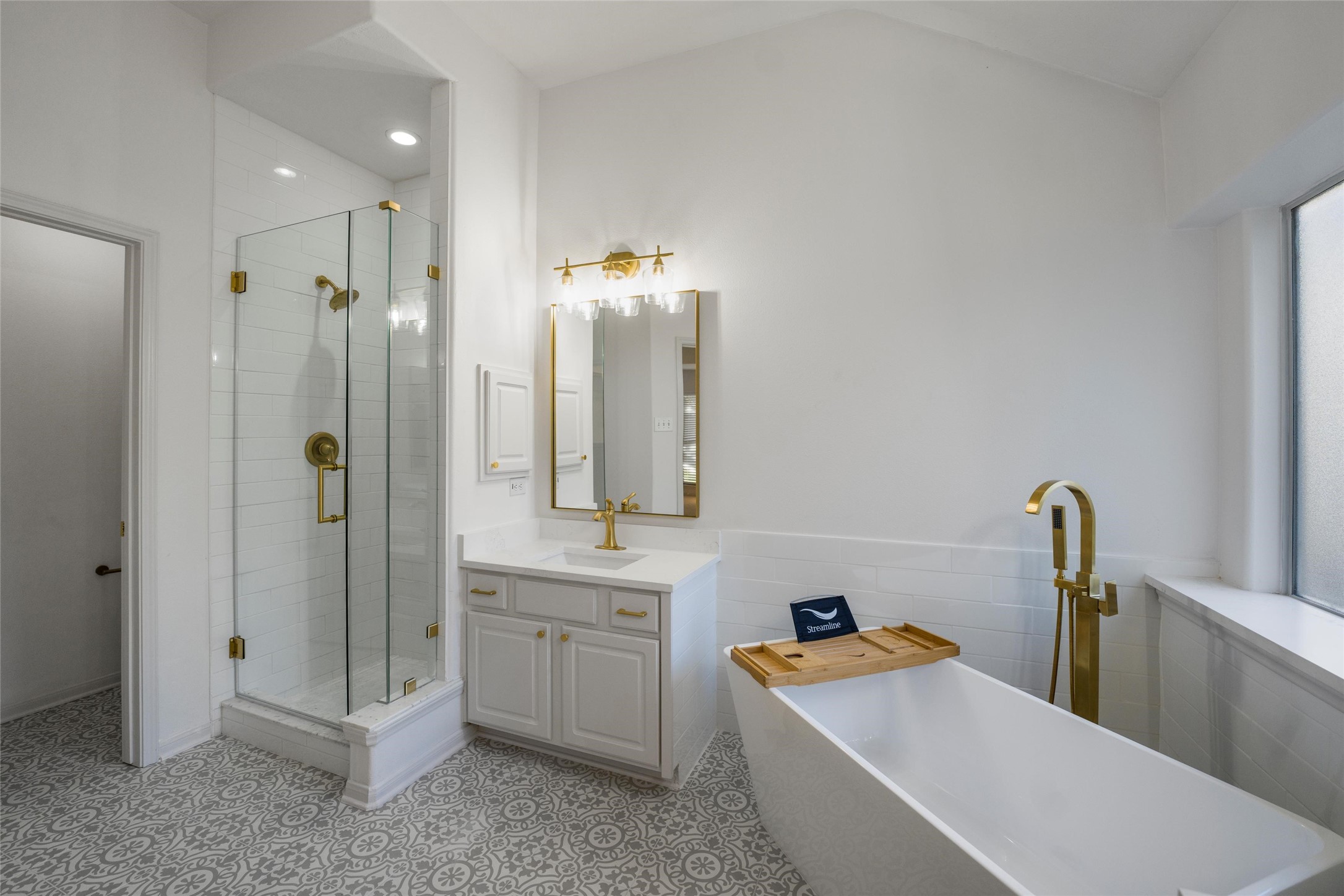 3303 Viking Landing Court Spring, TX 77388 - Photo 27 of 46 a bathroom with a tub sink and mirror
