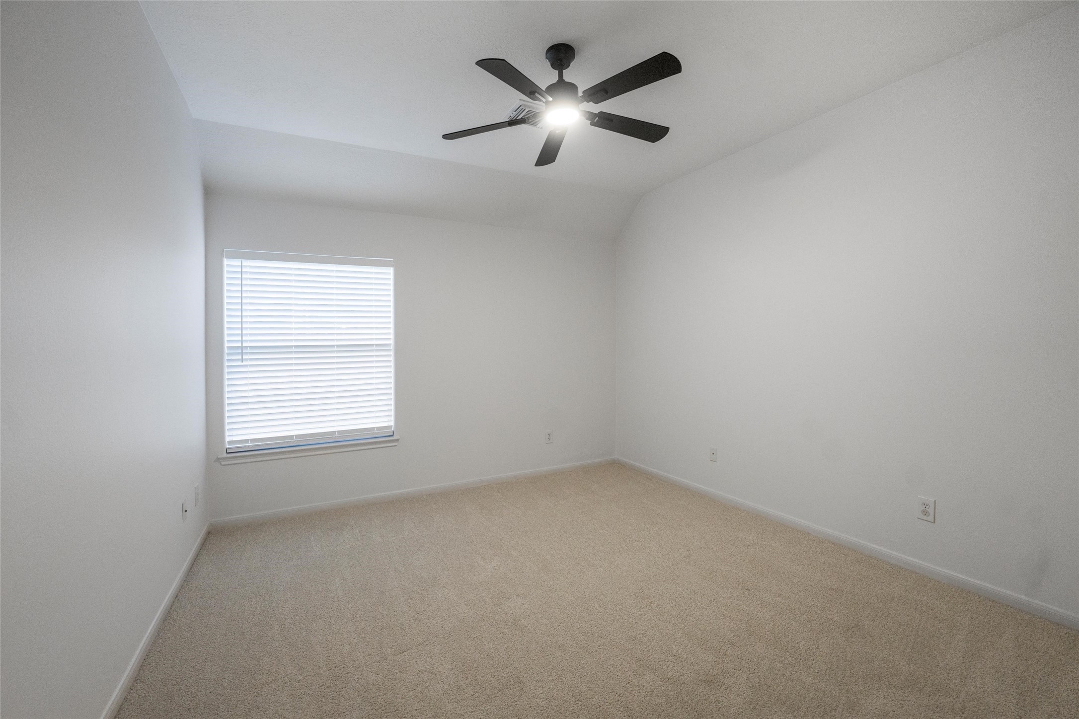 3303 Viking Landing Court Spring, TX 77388 - Photo 29 of 46 an empty room with a window and a fan