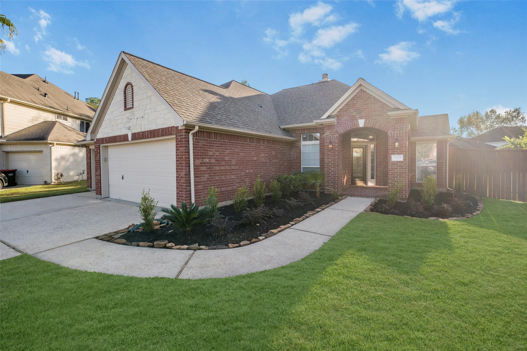 3303 Viking Landing Court Spring, TX 77388 - Photo 4 of 46 a front view of a house with a yard and garage
