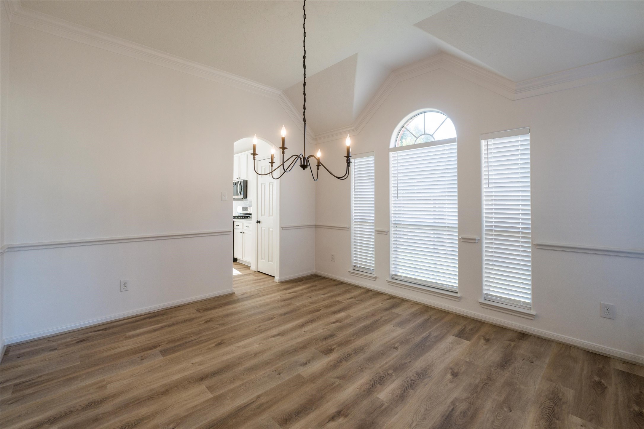 3303 Viking Landing Court Spring, TX 77388 - Photo 9 of 46 an empty room with wooden floor mirror and window