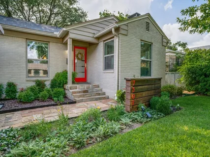 a front view of house with an outdoor seating