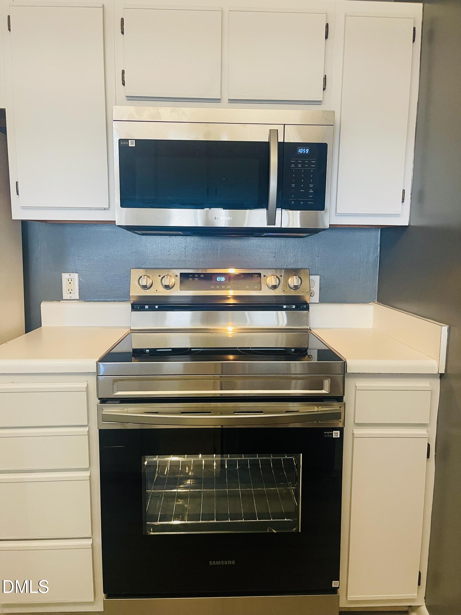 1230 University Court, Unit 204 Raleigh, NC 27606 - Photo 3 of 17 a stove top oven sitting inside of a kitchen