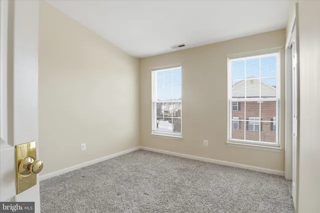 a bathroom with a shower a sink and a mirror