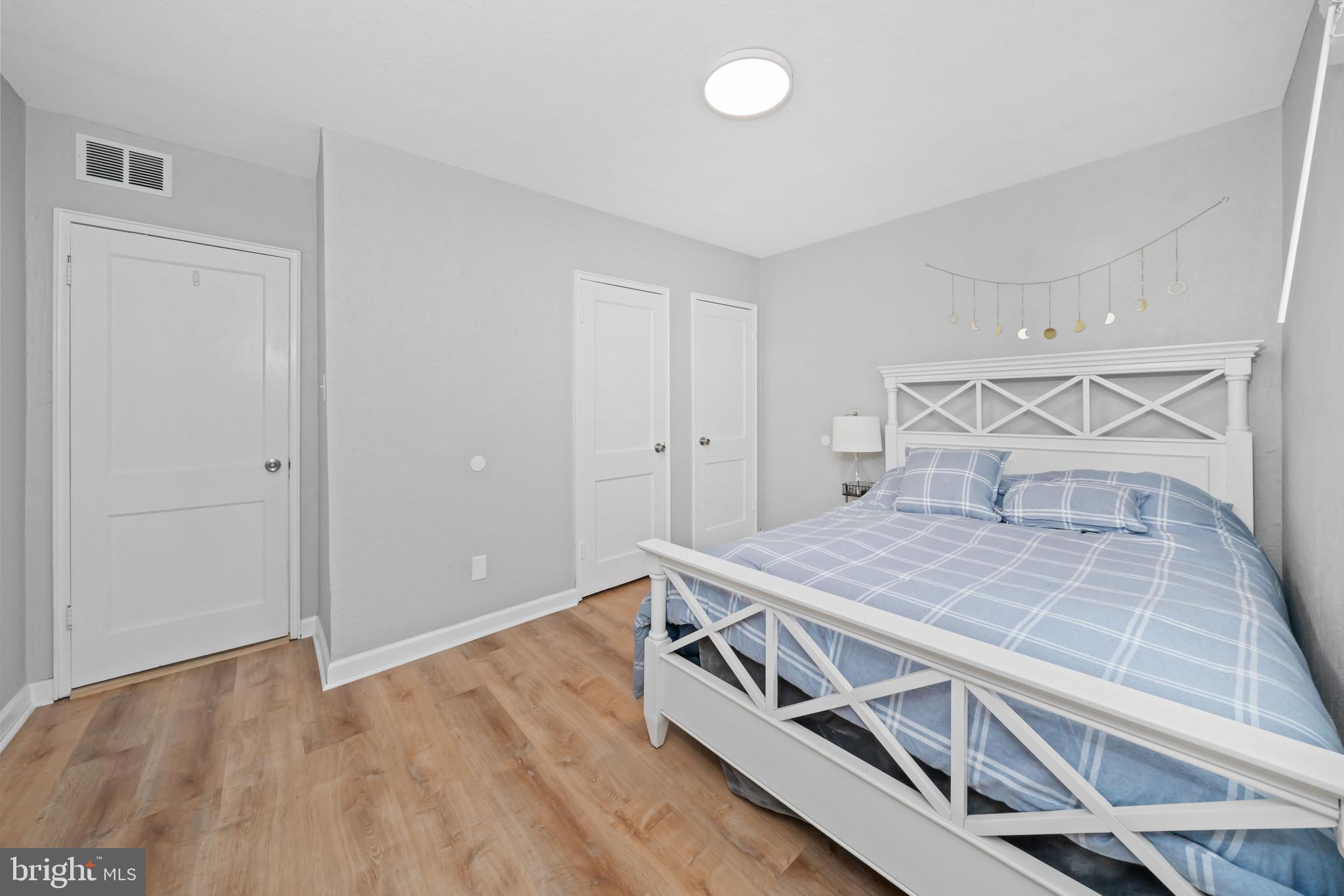 704 Harwood Road Wilmington, DE 19804 - Photo 21 of 30 a bedroom with a bed and a cabinets