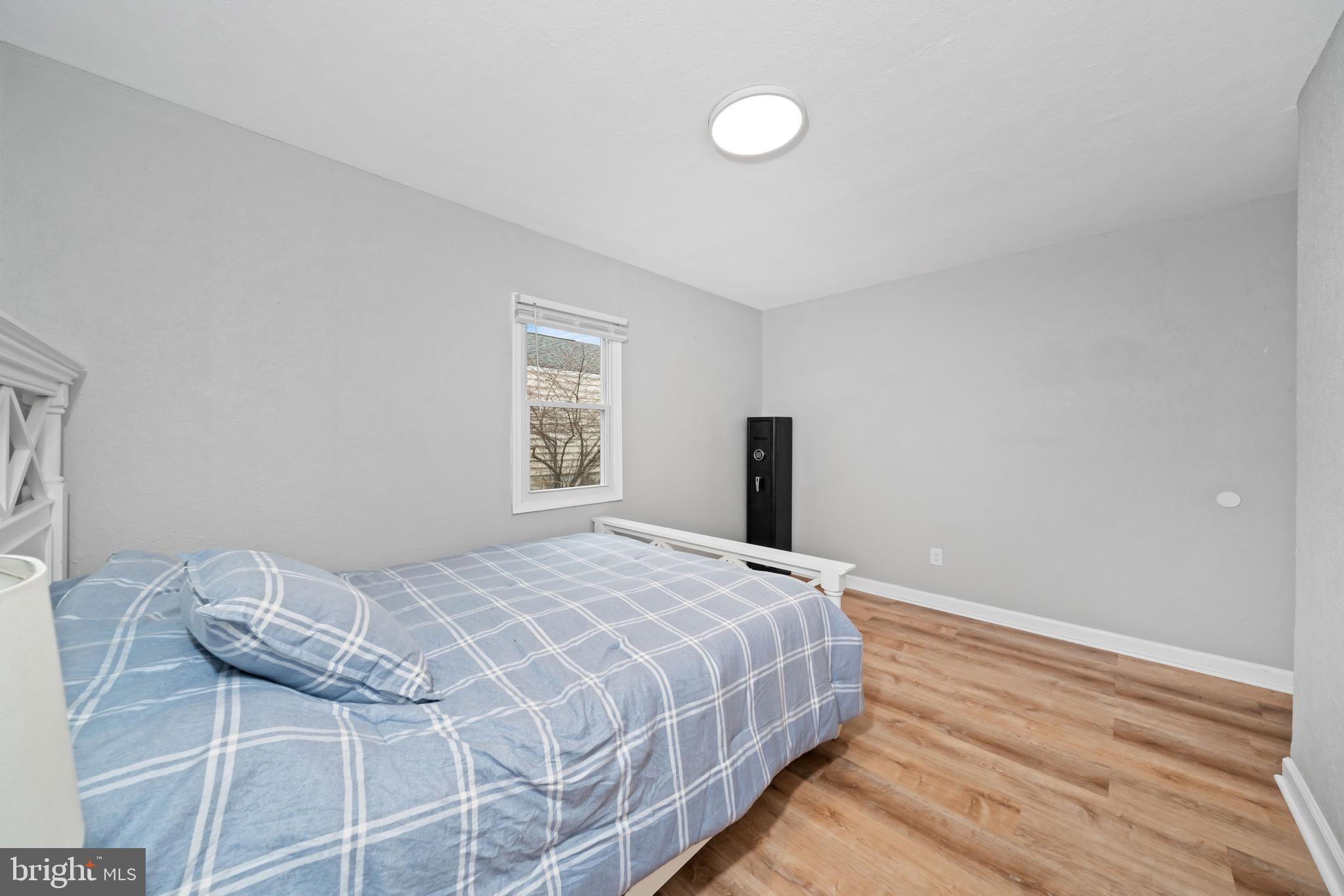 704 Harwood Road Wilmington, DE 19804 - Photo 22 of 30 a bedroom with a bed and a window