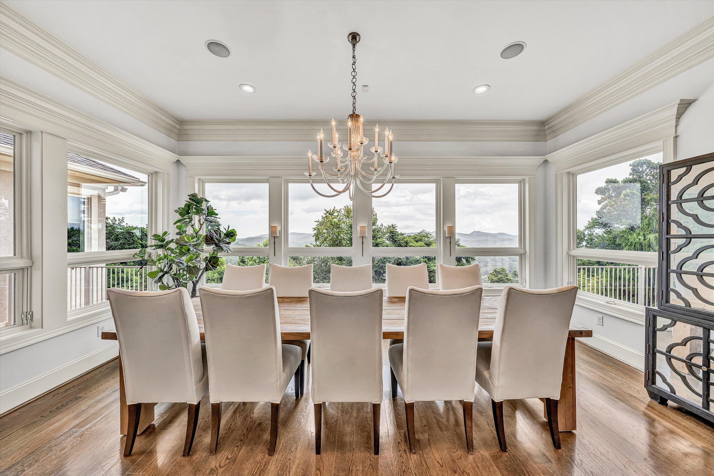 10947 Bottom Creek Road Bent Mountain, VA 24059 - Photo 12 of 59 a view of a dining room with furniture window and wooden floor