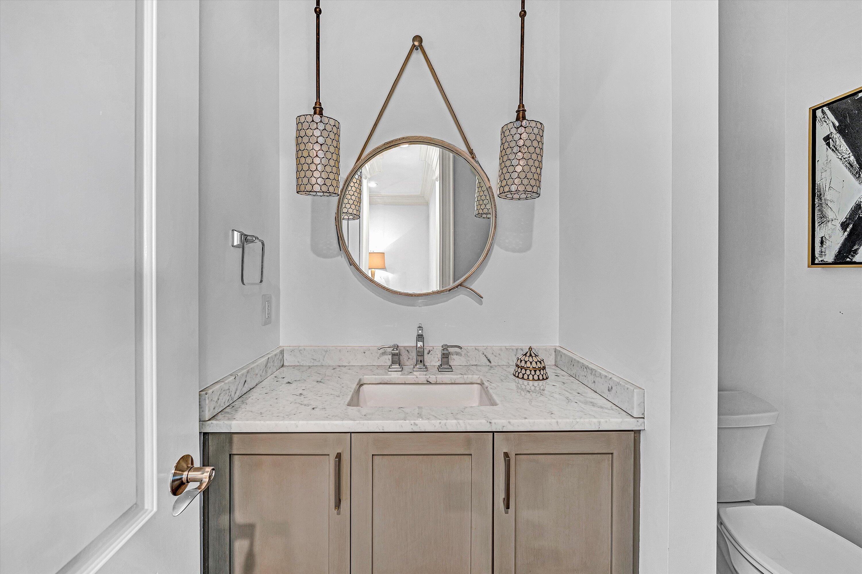 10947 Bottom Creek Road Bent Mountain, VA 24059 - Photo 18 of 59 a bathroom with a granite countertop sink a mirror and vanity