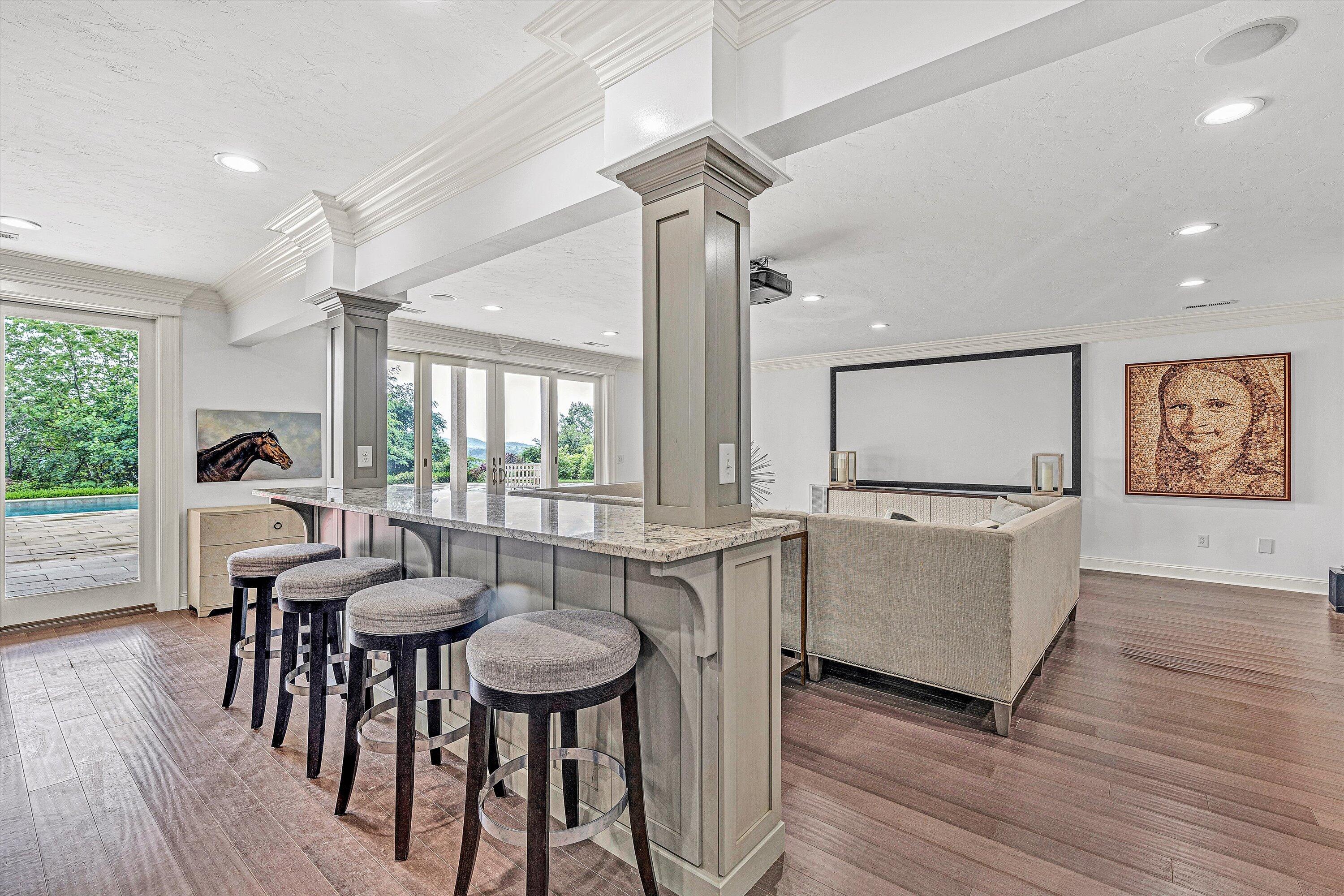 10947 Bottom Creek Road Bent Mountain, VA 24059 - Photo 29 of 59 a view of a dining room with furniture window and wooden floor