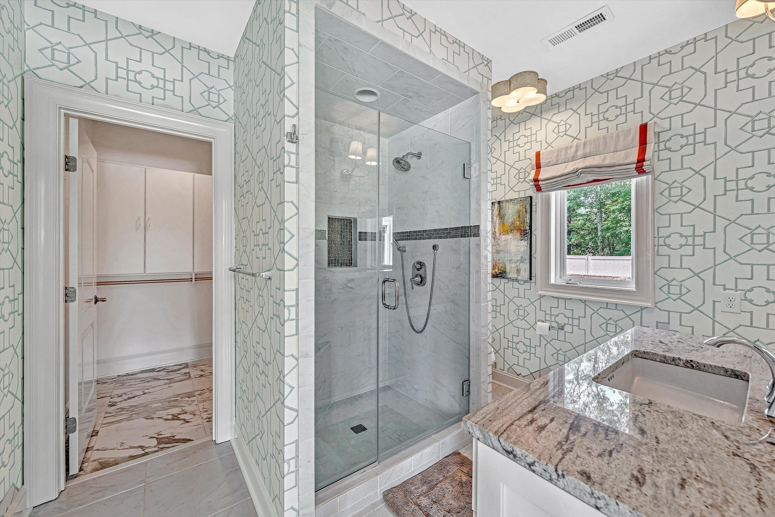 10947 Bottom Creek Road Bent Mountain, VA 24059 - Photo 42 of 59 a bathroom with a granite countertop shower mirror and a sink