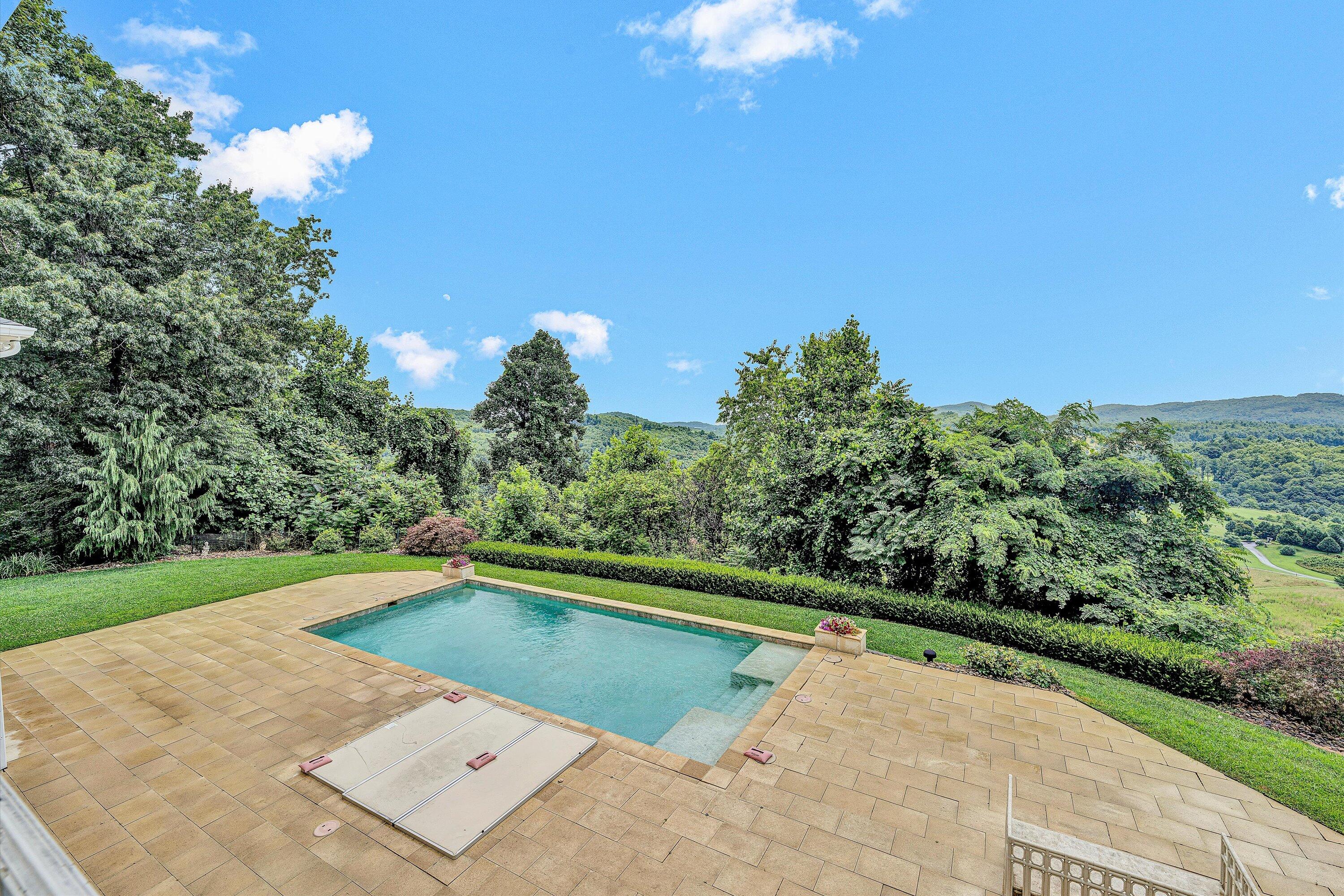 10947 Bottom Creek Road Bent Mountain, VA 24059 - Photo 7 of 59 a view of a swimming pool with an outdoor space and seating area