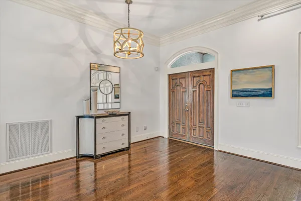a spacious bathroom with a granite countertop sink mirror and a toilet