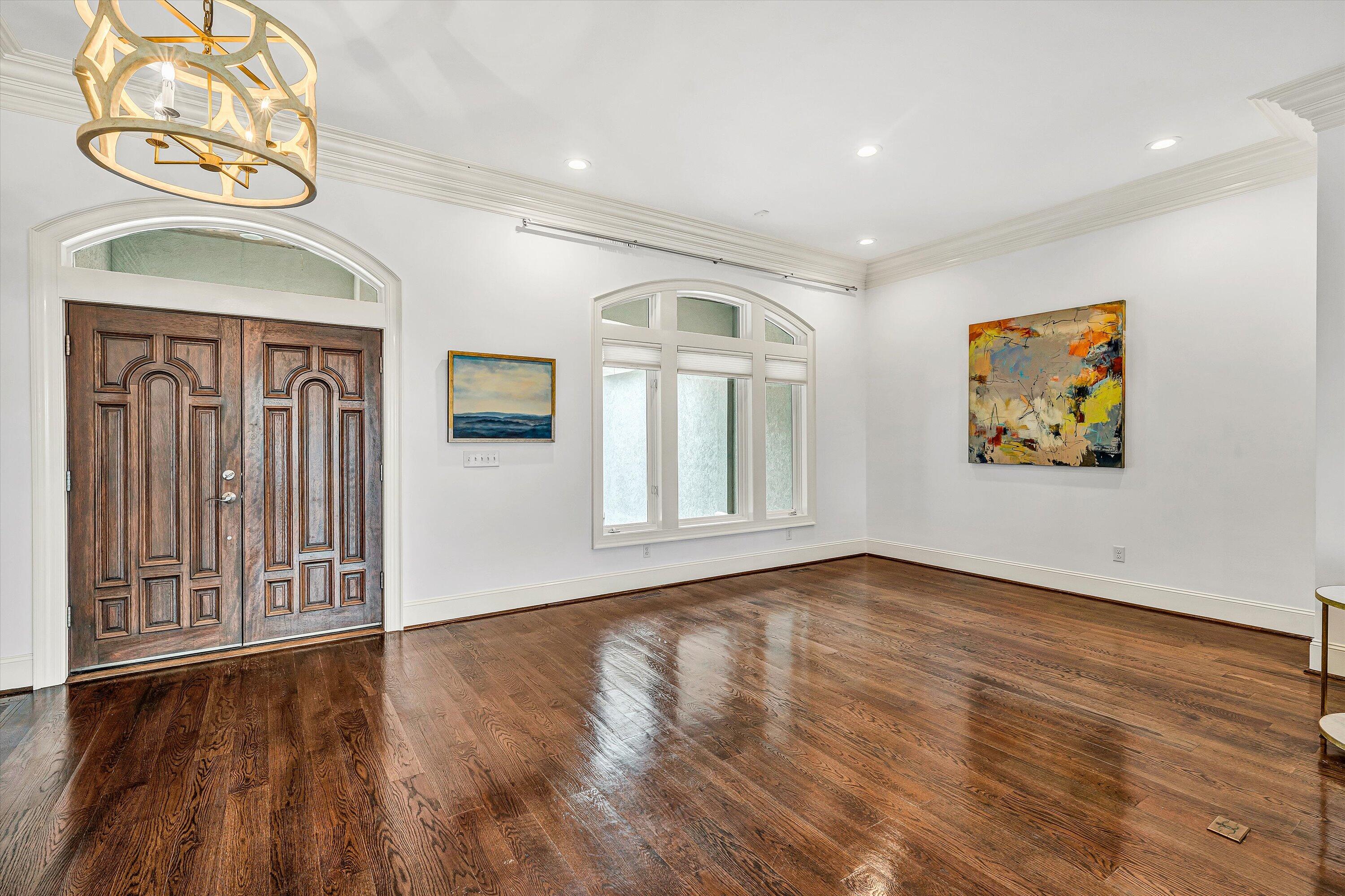 10947 Bottom Creek Road Bent Mountain, VA 24059 - Photo 9 of 59 a view of an empty room with wooden floor and a window