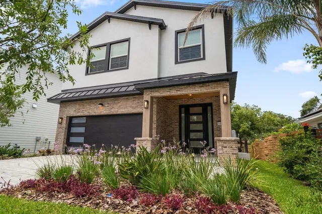 front view of a house with a small yard