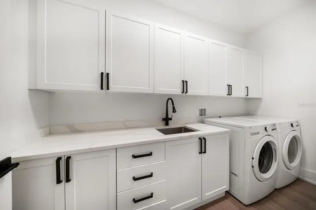 a utility room with dryer and washer