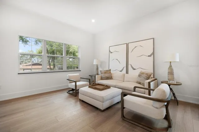 a living room with furniture and a window