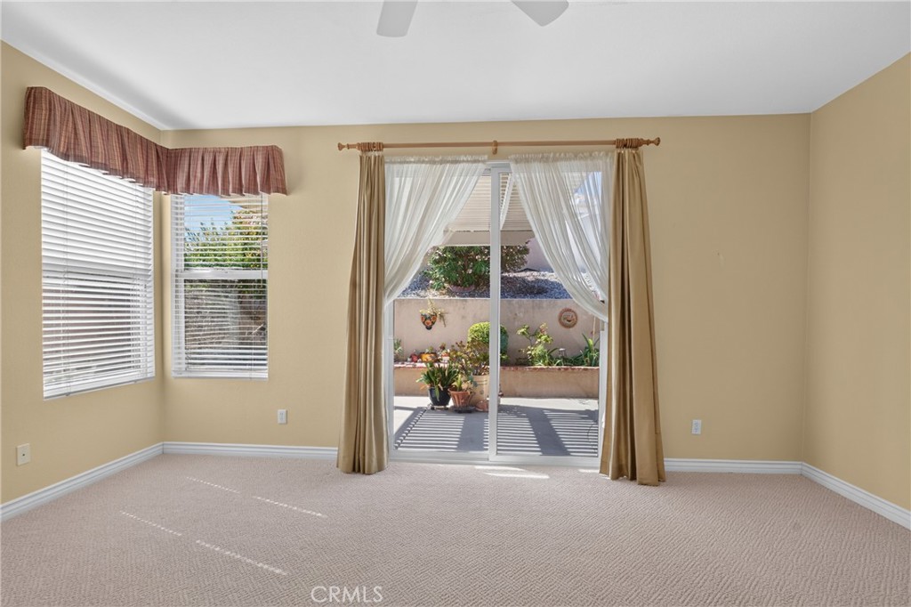 5001 Rio Bravo Drive Banning, CA 92220 - Photo 26 of 38 Looking out the sliding door in the primary bedroom