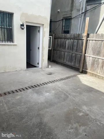 a view of a livingroom with wooden floor and cabinet