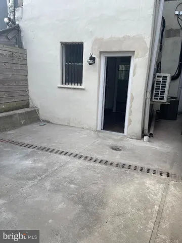 a view of a staircase with white walls