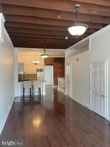 a view of dining room with furniture and wooden floor