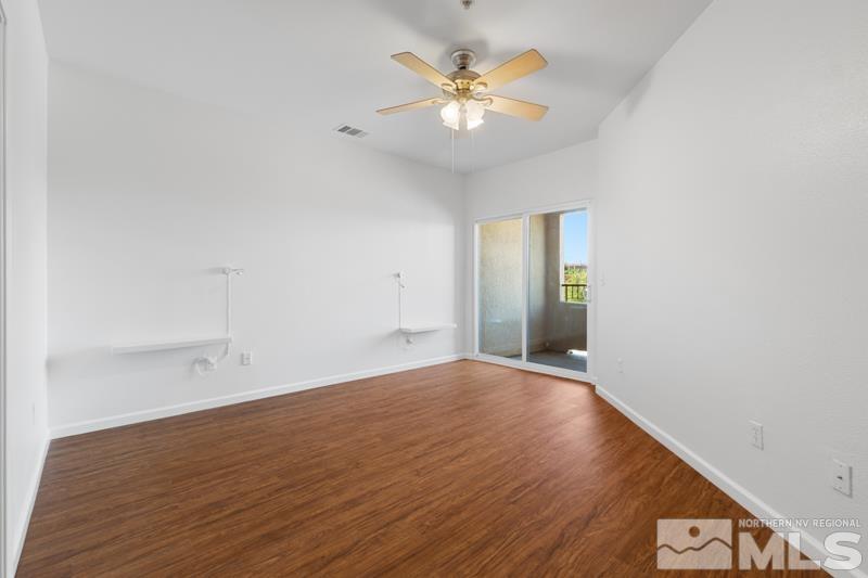 17000 Wedge Parkway, Unit 2925 Reno, NV 89511 - Photo 12 of 23 wooden floor in an empty room