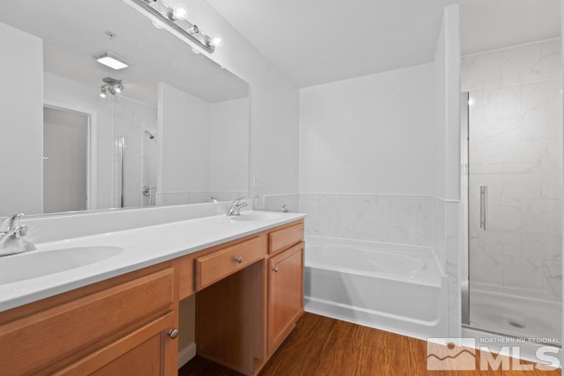 17000 Wedge Parkway, Unit 2925 Reno, NV 89511 - Photo 14 of 23 a bathroom with a tub sink vanity and a mirror