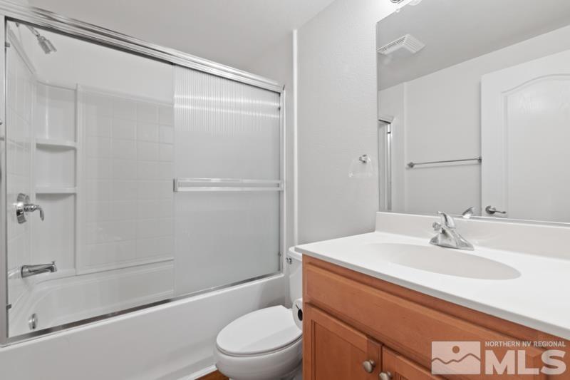 17000 Wedge Parkway, Unit 2925 Reno, NV 89511 - Photo 18 of 23 a bathroom with a sink a mirror toilet and shower
