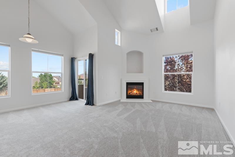 17000 Wedge Parkway, Unit 2925 Reno, NV 89511 - Photo 4 of 23 a view of an empty room with a window and a fireplace
