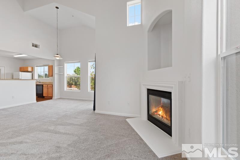 17000 Wedge Parkway, Unit 2925 Reno, NV 89511 - Photo 9 of 23 a view of an empty room with fireplace and a window