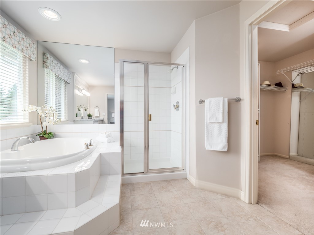 20104 27th Avenue Southeast Bothell, WA 98012 - Photo 17 of 27 a spacious bathroom with a tub shower and sink