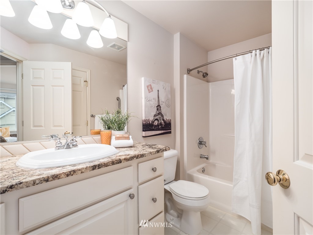 20104 27th Avenue Southeast Bothell, WA 98012 - Photo 21 of 27 a bathroom with a granite countertop sink toilet and shower